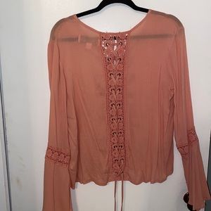 Beautiful top! Peach color. Size Medium. Great condition.